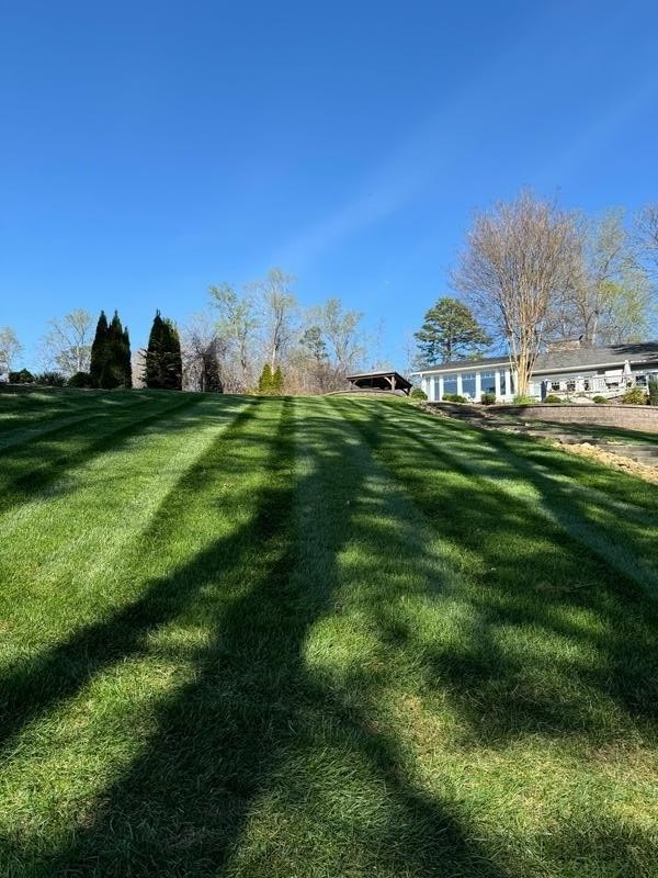 Lawn care work in Hickory, NC by Oasis Property Management